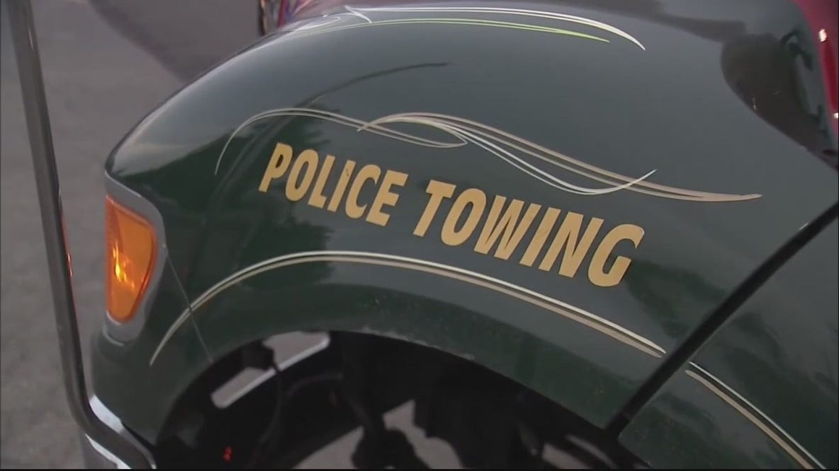 Ex-Detroit police officer charged with taking bribes in towing scandal
