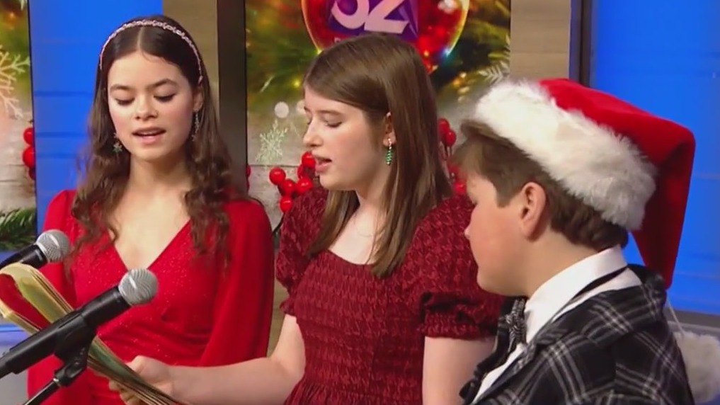 Singers from the Hix Brothers Music School perform Christmas carols