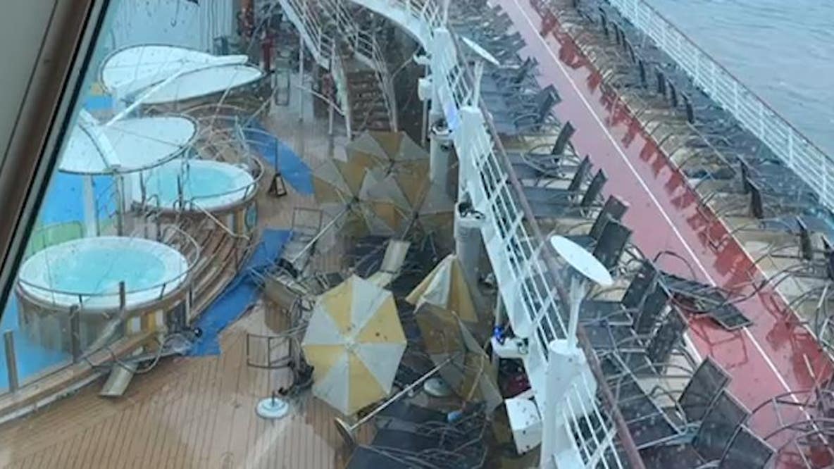 People scramble as storm batters cruise ship