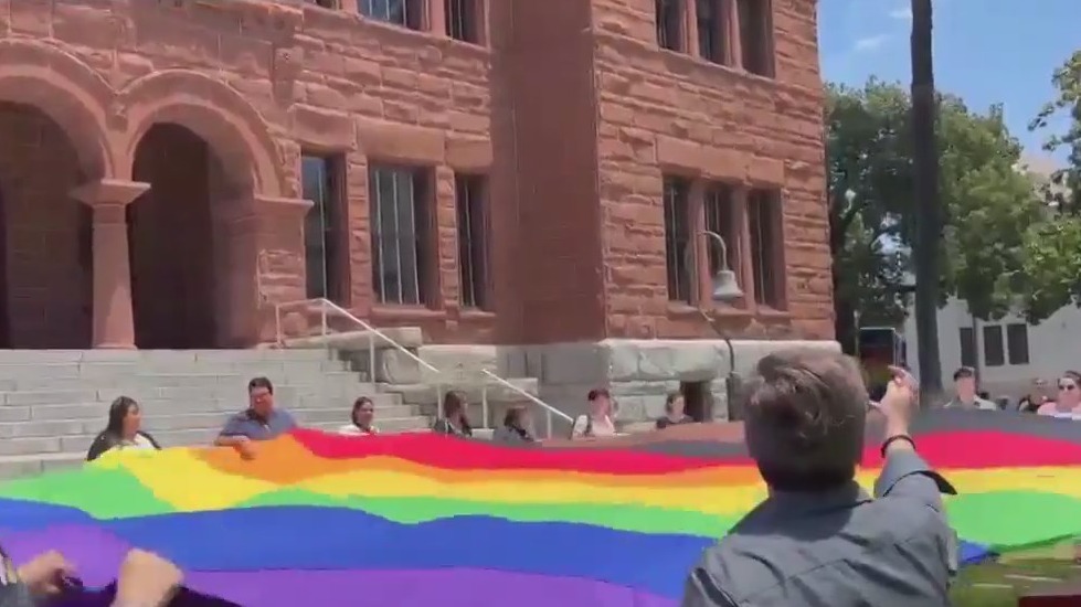 Supervisors unfurl giant Pride flag in OC