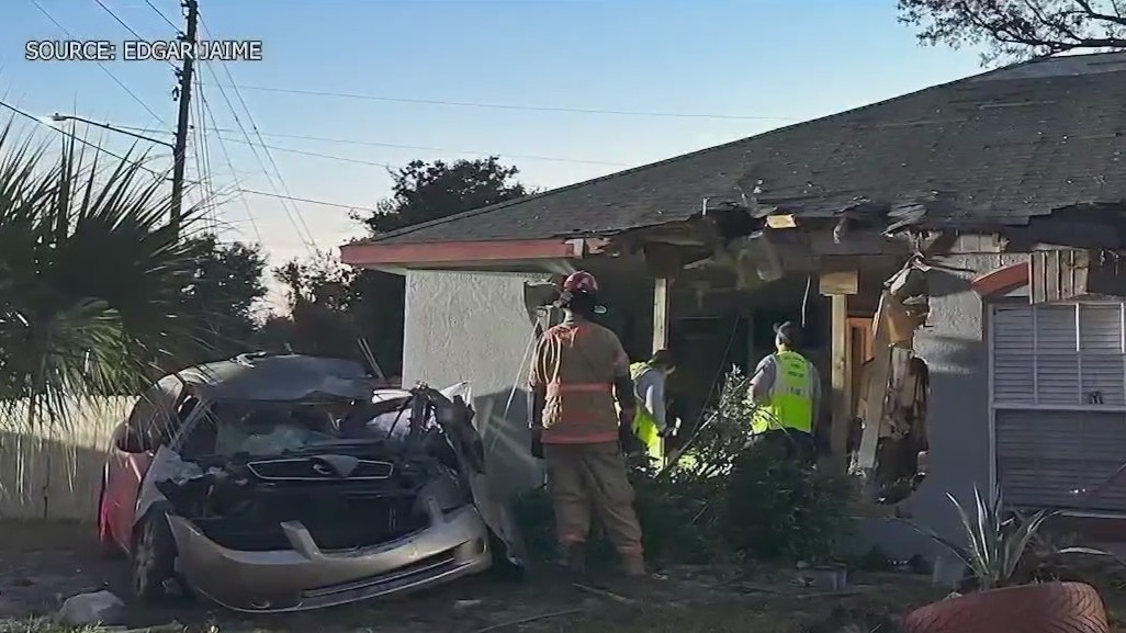 Family waits on city after car crash in home