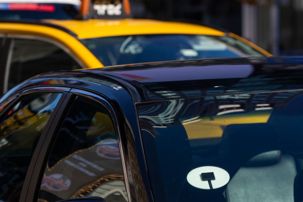 Uber partners with taxi companies to boost supply