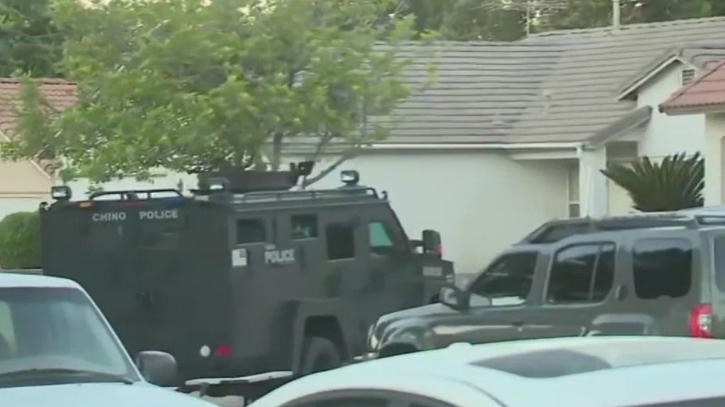 Suspect accused of running over officer killed in shootout