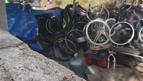 FOX 11 report leads to police raid of stolen bike chop shop in homeless encampment
