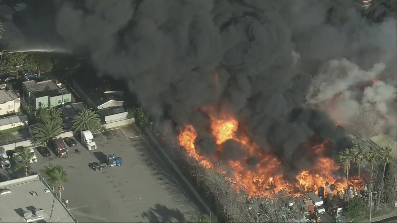 Massive fire breaks out at a pallet yard in Compton