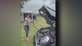Texas mom removes snake from daughter's car engine with no hesitation: video