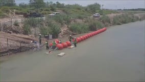 DOJ threatens to sue Texas over floating border wall