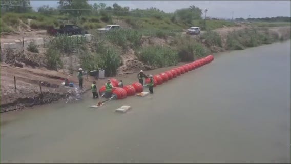 DOJ threatens to sue Texas over floating border wall