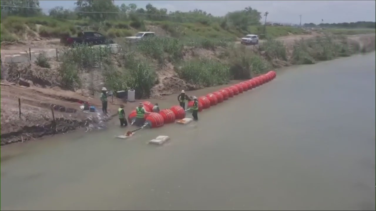 DOJ threatens to sue Texas over floating border wall