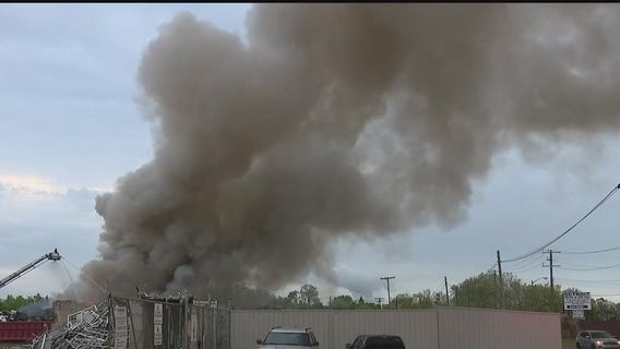 Flames tower over Detroit scrap yard fire Wednesday morning