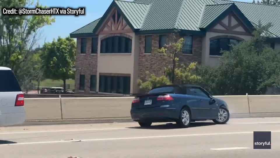 VIDEO: Towed car erratically swerves across freeway
