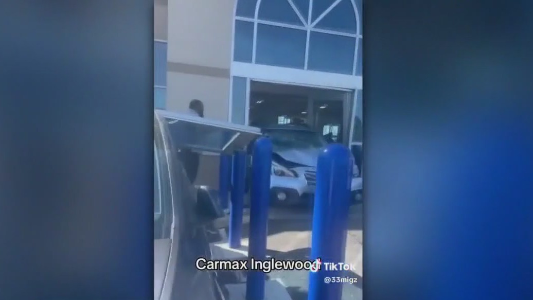 Customer smashes SUV into CarMax store