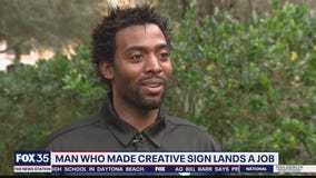 Man handing out resumes has finally received a job