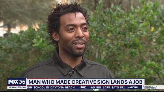 Man handing out resumes has finally received a job