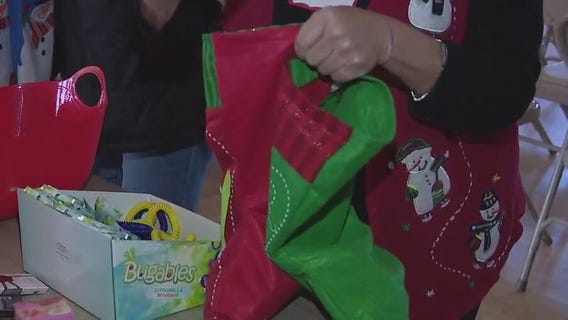 Volunteers assemble hundreds of Christmas stockings for children of farmworkers