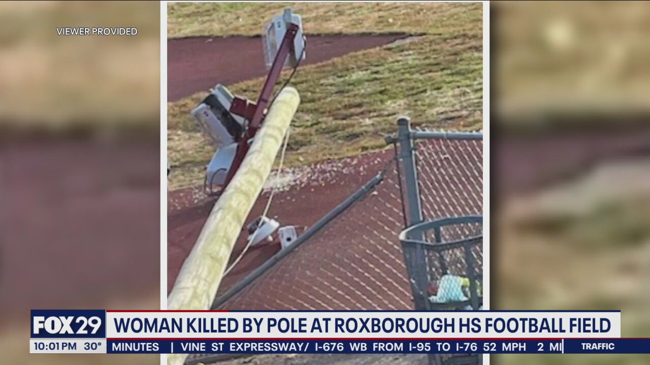 Woman killed on track field after wind gust snapped light pole, hitting her