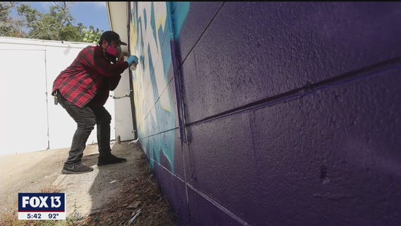 Artists brighten bland laundromats with murals