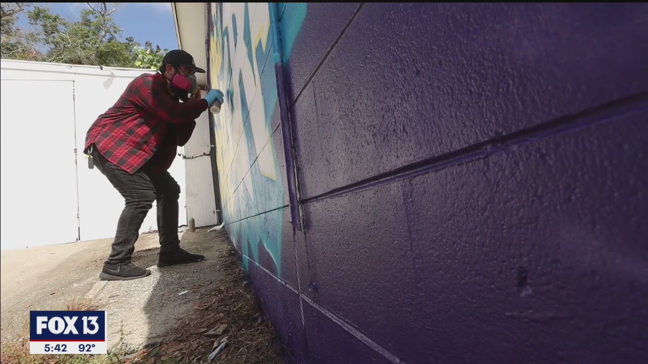 Artists brighten bland laundromats with murals