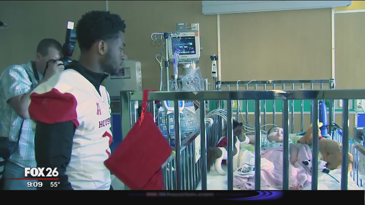 UH football players visit Children's Hospital