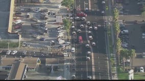 Protesters clash with sheriff's deputies at a beauty supply store