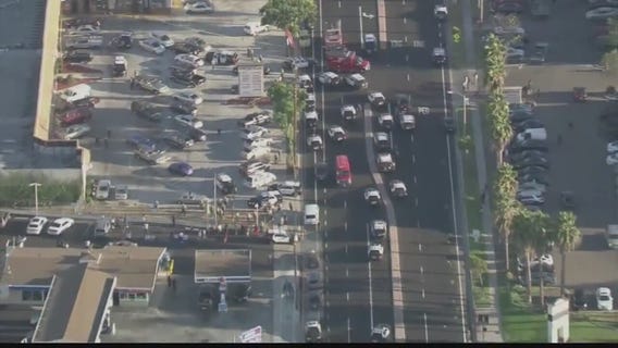 Protesters clash with sheriff's deputies at a beauty supply store