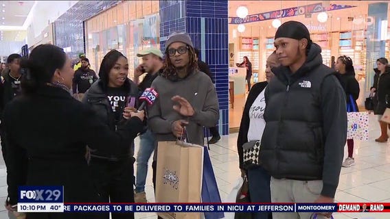 Last minute shoppers head to Cherry Hill Mall on Christmas Eve.