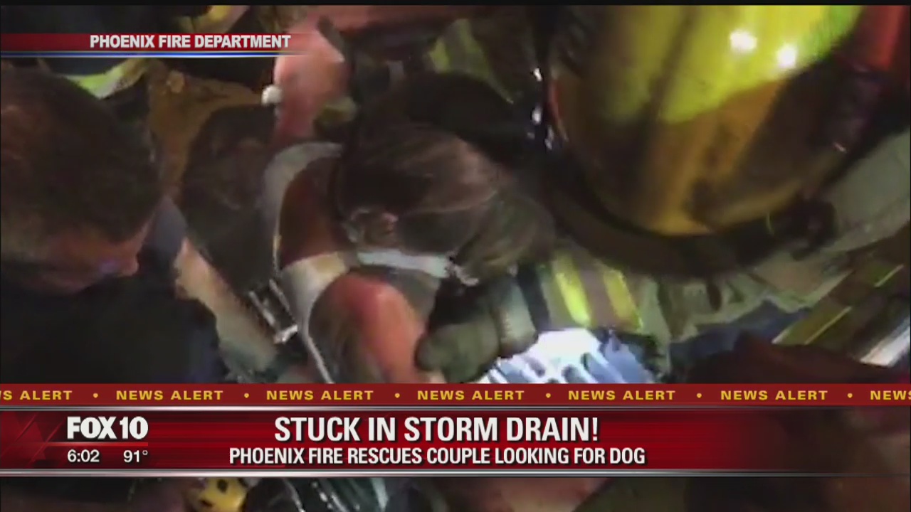 Two people stuck in storm drain