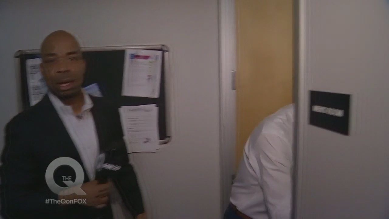 Poor Q had to go to great lengths on National Hug a Newsperson Day