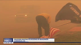 Powerful winds fuel CA wildfire, dozens of buildings destroyed