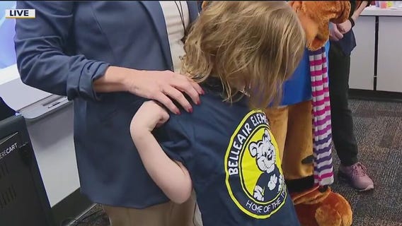 Volunteer buys uniforms for students