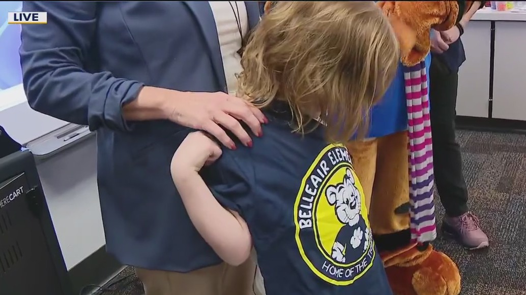 Volunteer buys uniforms for students