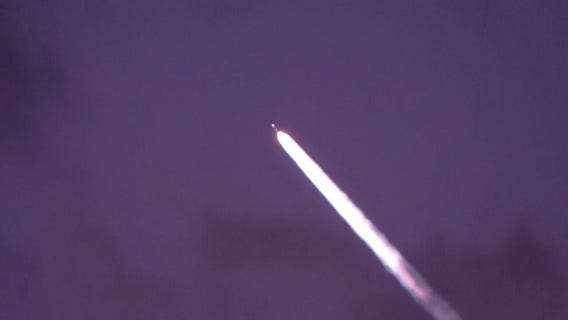 No, they aren't aliens. It's SpaceX