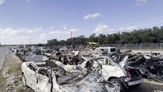 Vehicle scrap yard offers reminder of July 4th floods