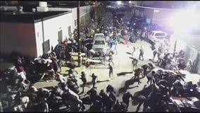 Drone video shows shooter open fire at rap concert