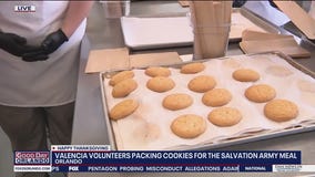 Valencia College volunteers pack cookies for Salvation Army meal