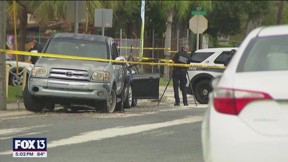 Man shot and killed while driving with child