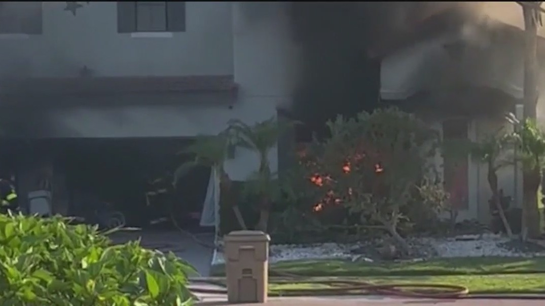 Car speeding down Kissimmee street crashes into home, sets it on fire