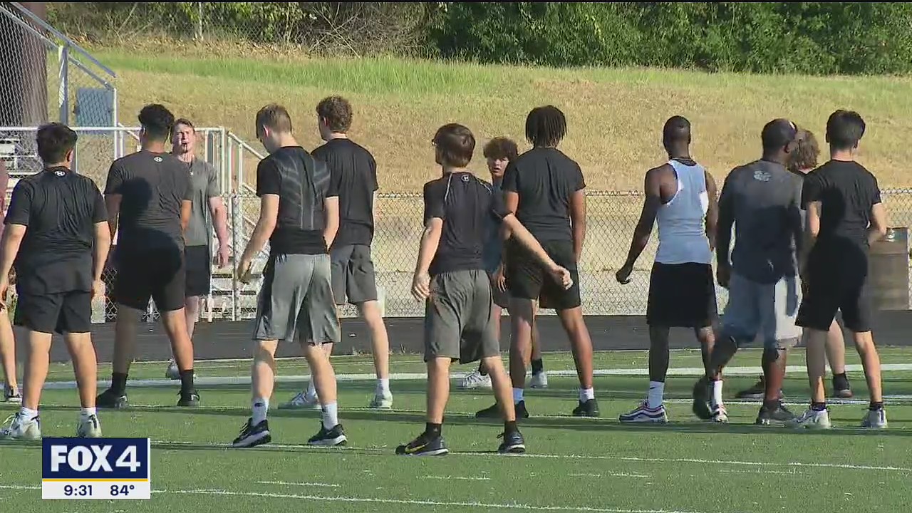 High school athletes endure workouts in the Texas heat