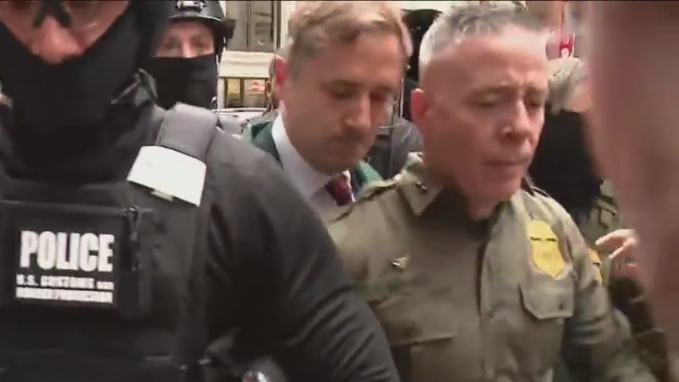 Rowdy Chicago crowd greets Border Patrol chief ahead of court hearing