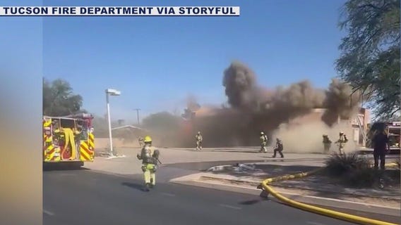 Building collapses with Tucson Firefighters on roof