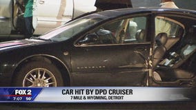DPD cruiser crashes with woman's car along 7 Mile, ripping her door off