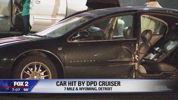 DPD cruiser crashes with woman's car along 7 Mile, ripping her door off