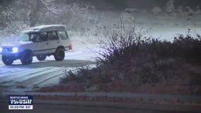 Travelers brace for snowy conditions over Snoqualmie Pass in WA