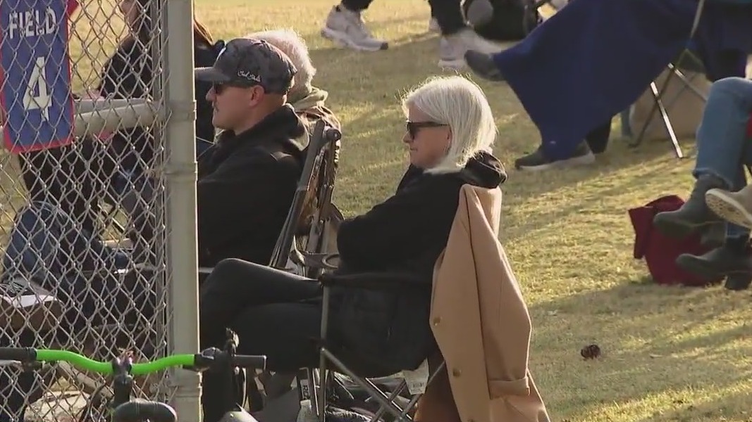 Families bundle up at Little League for cold front