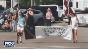 Girl carrying Dancing Grannies banner speaks after parade tragedy