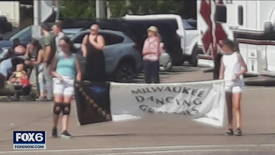 Girl carrying Dancing Grannies banner speaks after parade tragedy