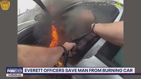 Everett officers save man from burning car