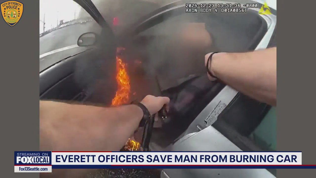 Everett officers save man from burning car