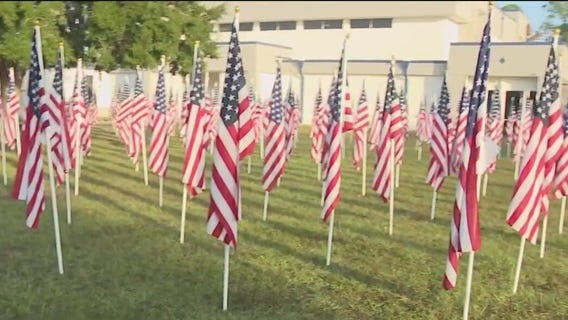 Flags fly in a Field of Honor in Spring Hill