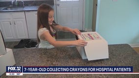 7-year-old suburban girl collecting crayons for hospital patients